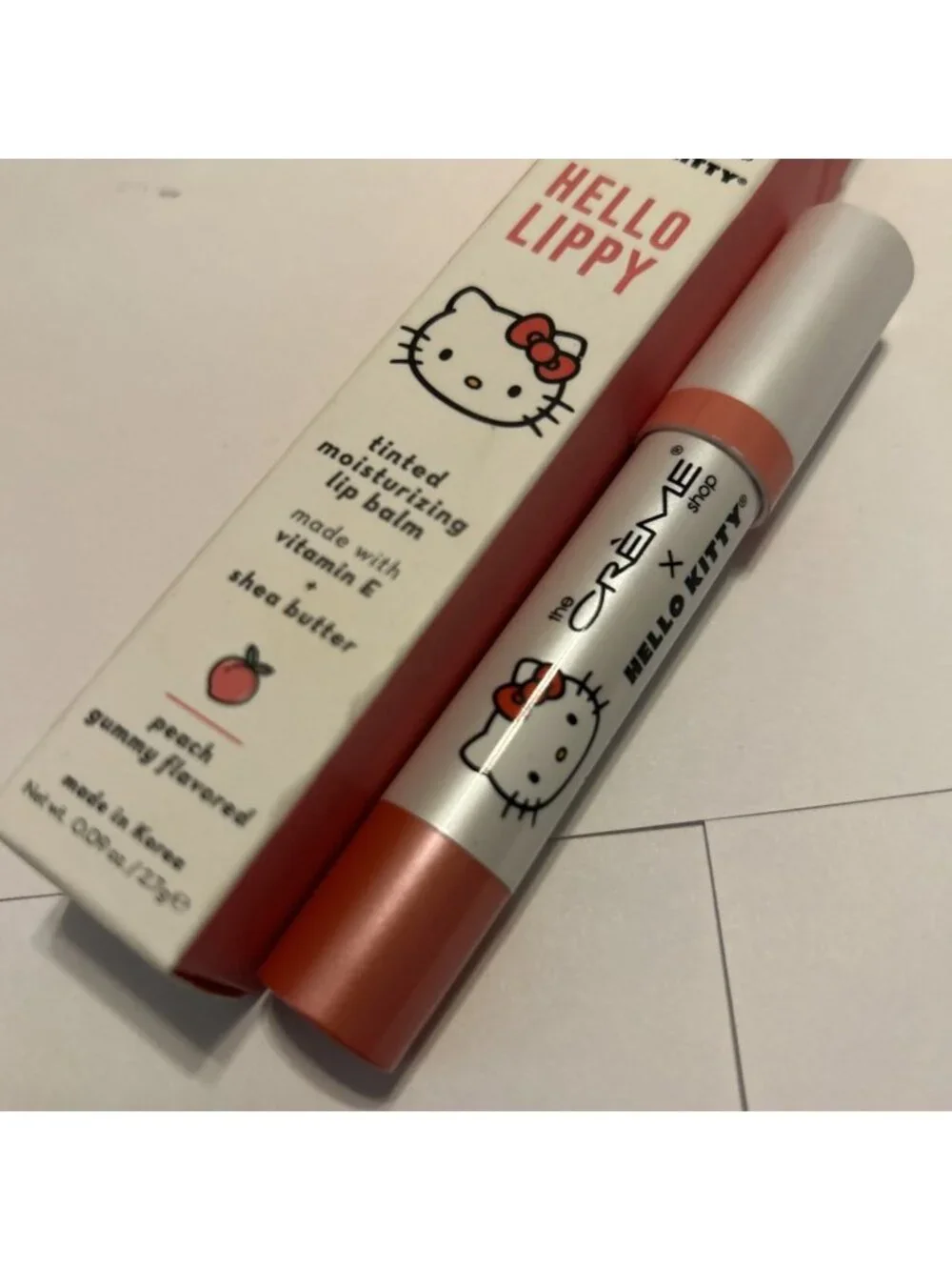The Crème Shop Hello Kitty & Friends Tinted Peach Moisture Lip Balm Stick .09oz